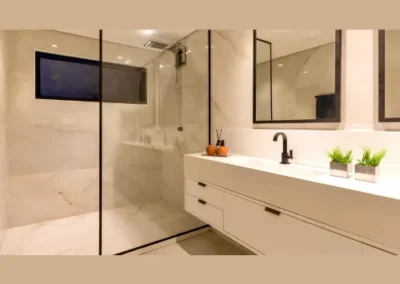 Modern bathroom interior design with sleek fittings, stylish tiles, and elegant lighting – Chennai home.