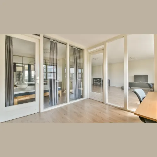 Modern partition interior design with wooden and glass dividers creating elegant space separation – Chennai home.